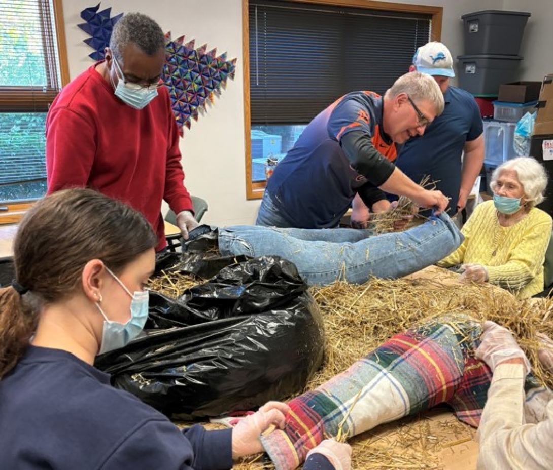 Silver Club Memory program participants stuff a scarecrow